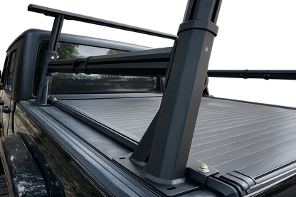 Height adjustable aluminum ladder rack fitted to ute tub over roller shutter