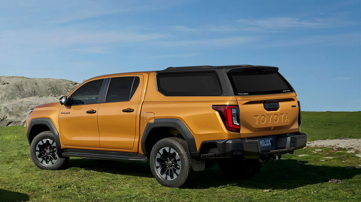 Maxliner Venture Canopy in two tone black accent finish on a 2026 Toyota HiLux