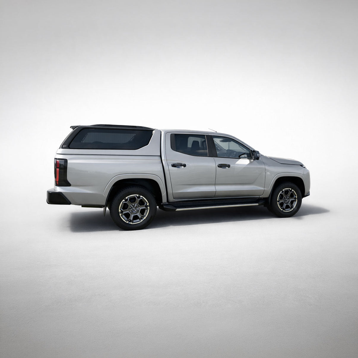 Nissan Navara with Maxliner Venture Canopy in silver, front three quarter view
