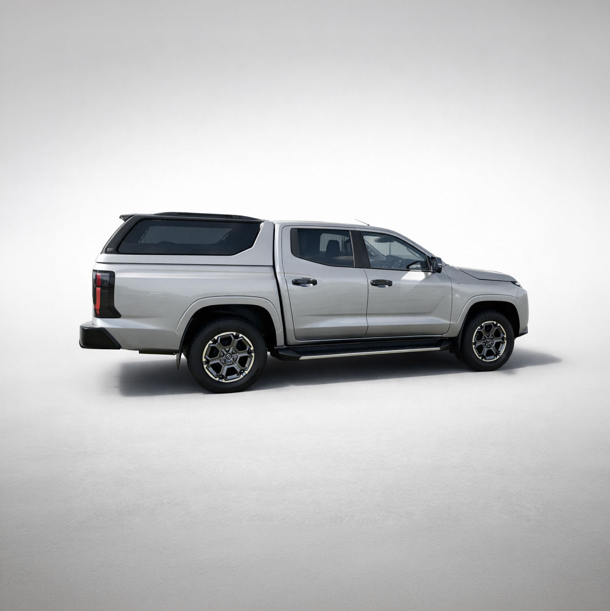 Nissan Navara with Maxliner Venture Canopy in silver, front three quarter view