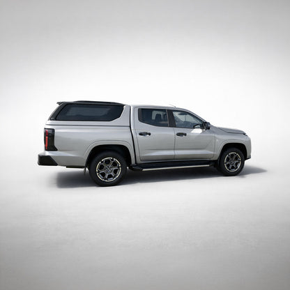 Nissan Navara with Maxliner Venture Canopy in silver, front three quarter view