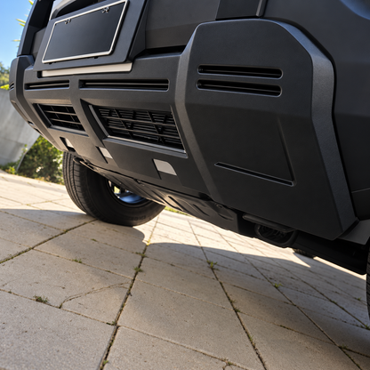 Close-up of the matte black lower guard fitted along the bottom edge of a BYD Shark 6 front bumper